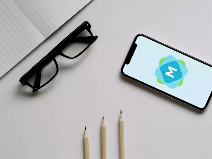 View Information about iPhone X on Office Desk Mockup